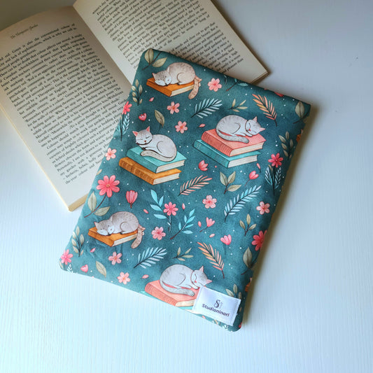Cat Sleeping on Book Sleeve