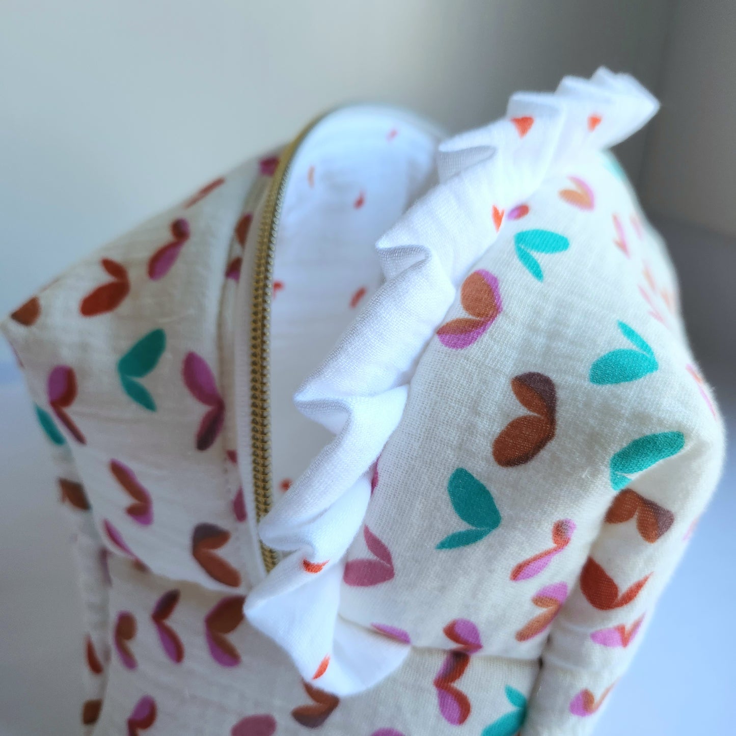 c. Yola Cosmetic Bag with Ruffle